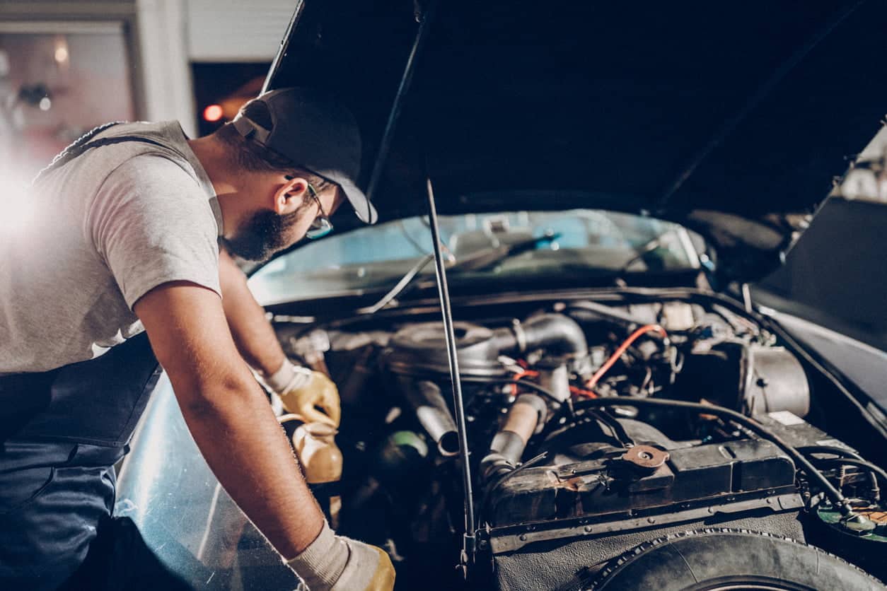mechanic looking at engine
